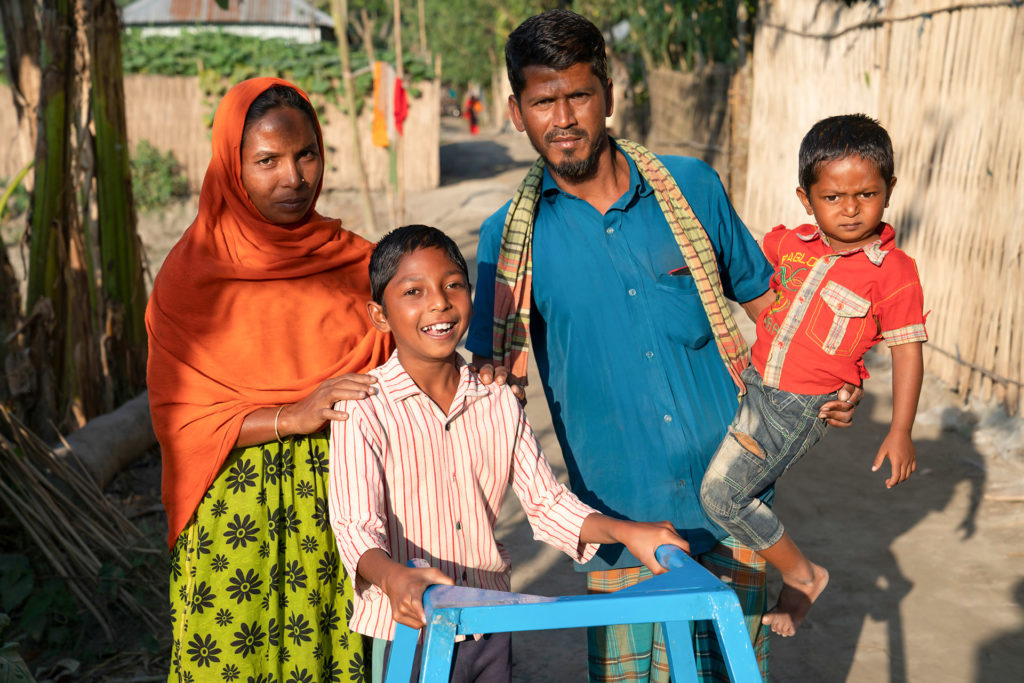 Tawhid, a child with disability with his family in Bangladesh