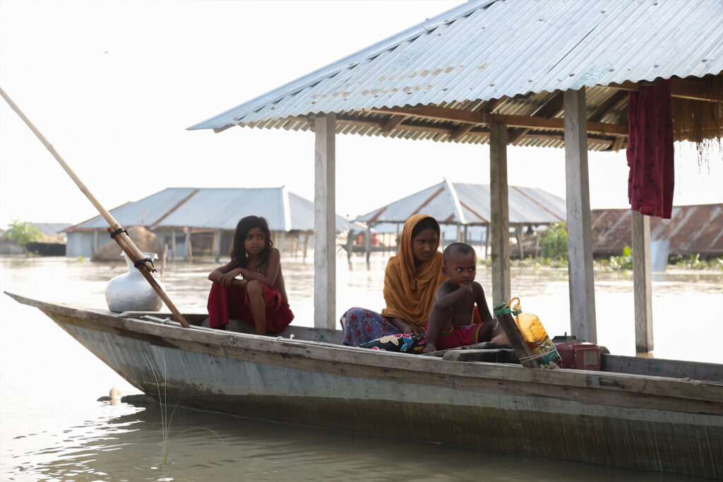 A family living on a boat during the Kurigram flood in 2022