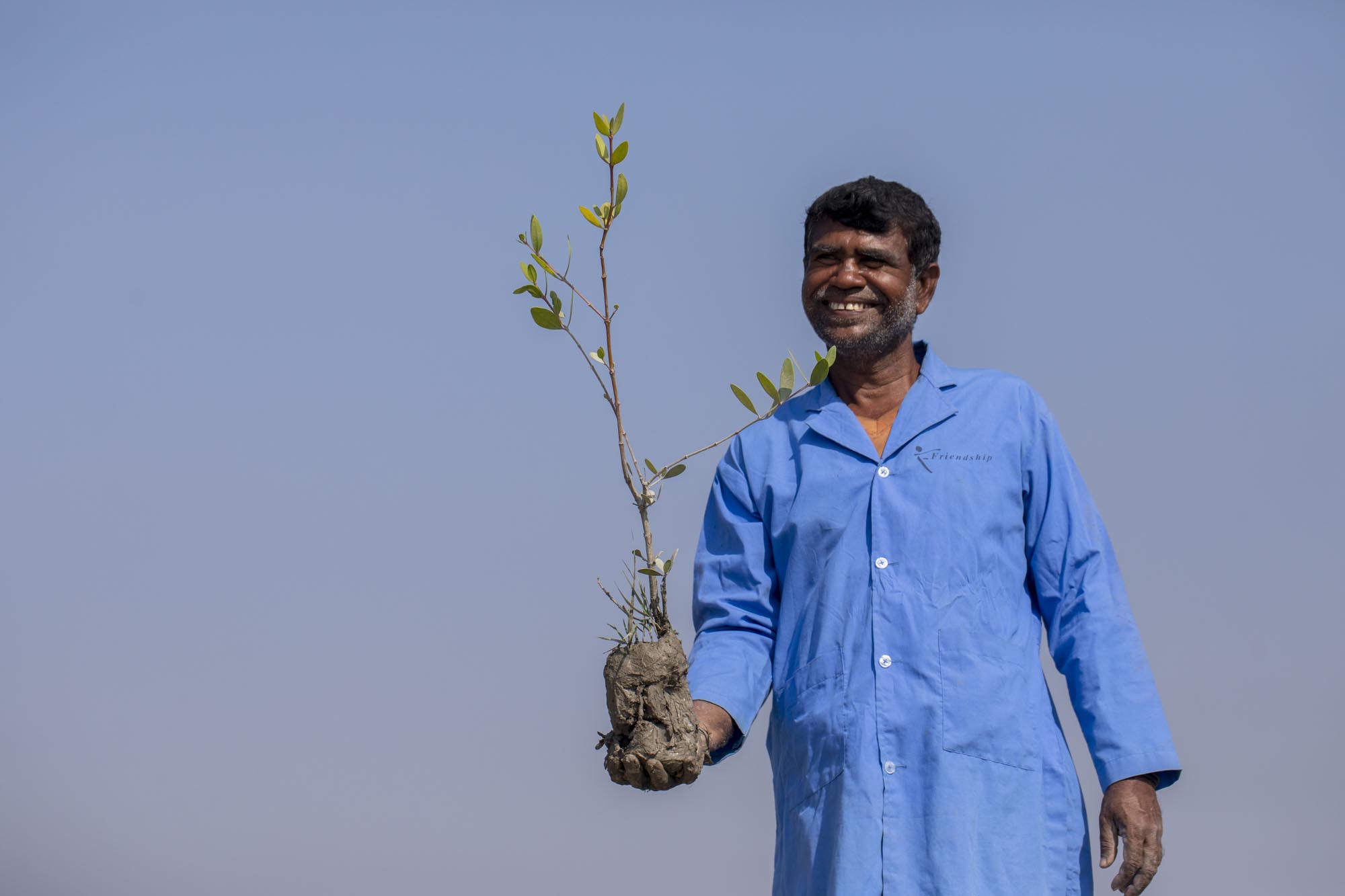 mangrove plant in Friendship caretaker's hand