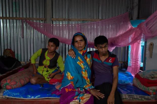 Mst. Rahima and her children on a Friendship plinth in Chilmari, Bangladesh