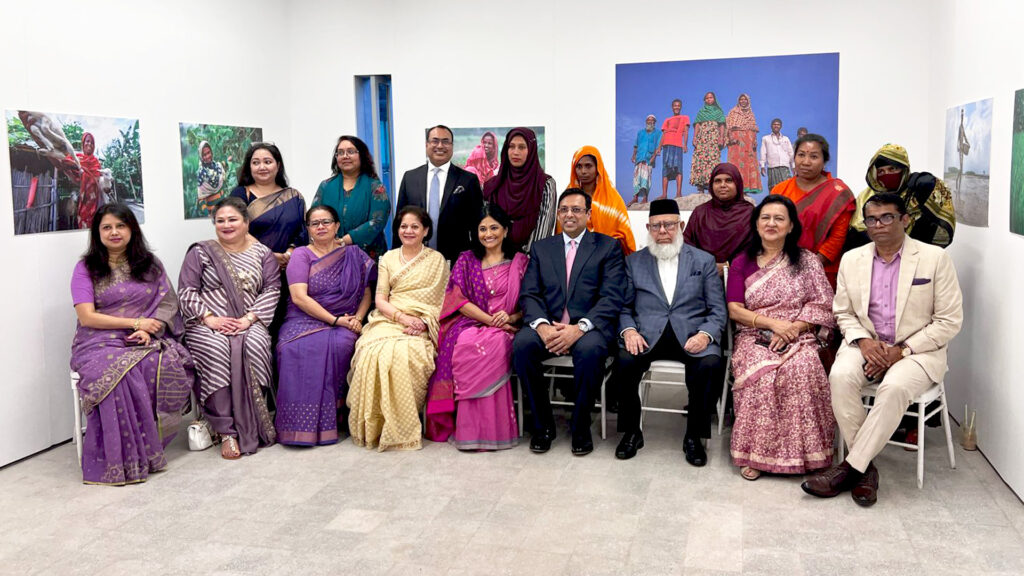 Members of staff from both co-organisers, Standard Chartered Bangladesh and Friendship pose for a group picture at the International Women's Day ceremony
