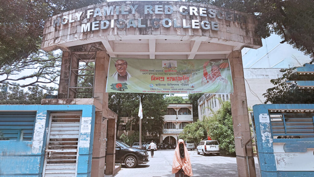 A char girl stands in front of the medical college that she has enrolled in